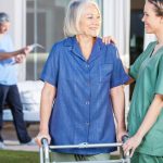 nurse encouraging patient after hip surgery