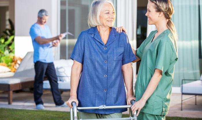 nurse encouraging patient after hip surgery
