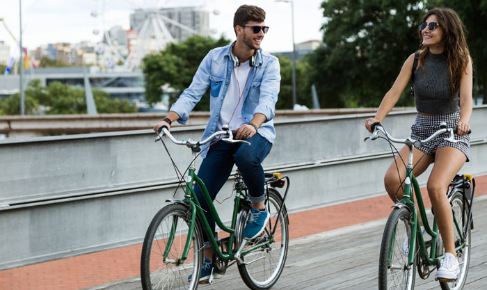 happy couple riding bikes